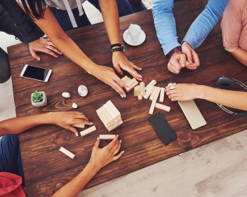 group of friends playing Jenga